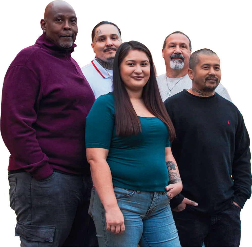 Five Friends Outside clients stand together in front of the Rising Phoenix mural.